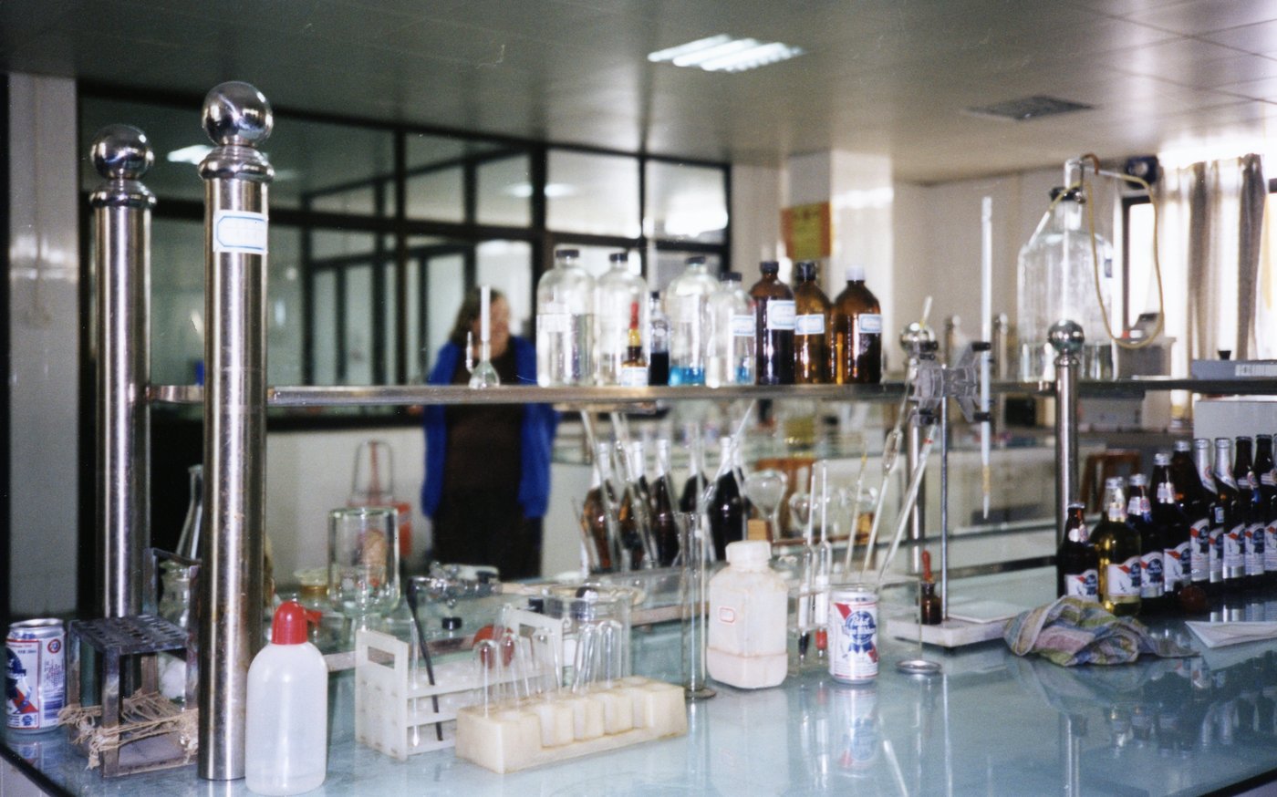 A brewery quality-control bench. At commercial scale, consistency and shelf-stability — gravity, pH, sensory, dissolved oxygen — become as important as the recipe itself.