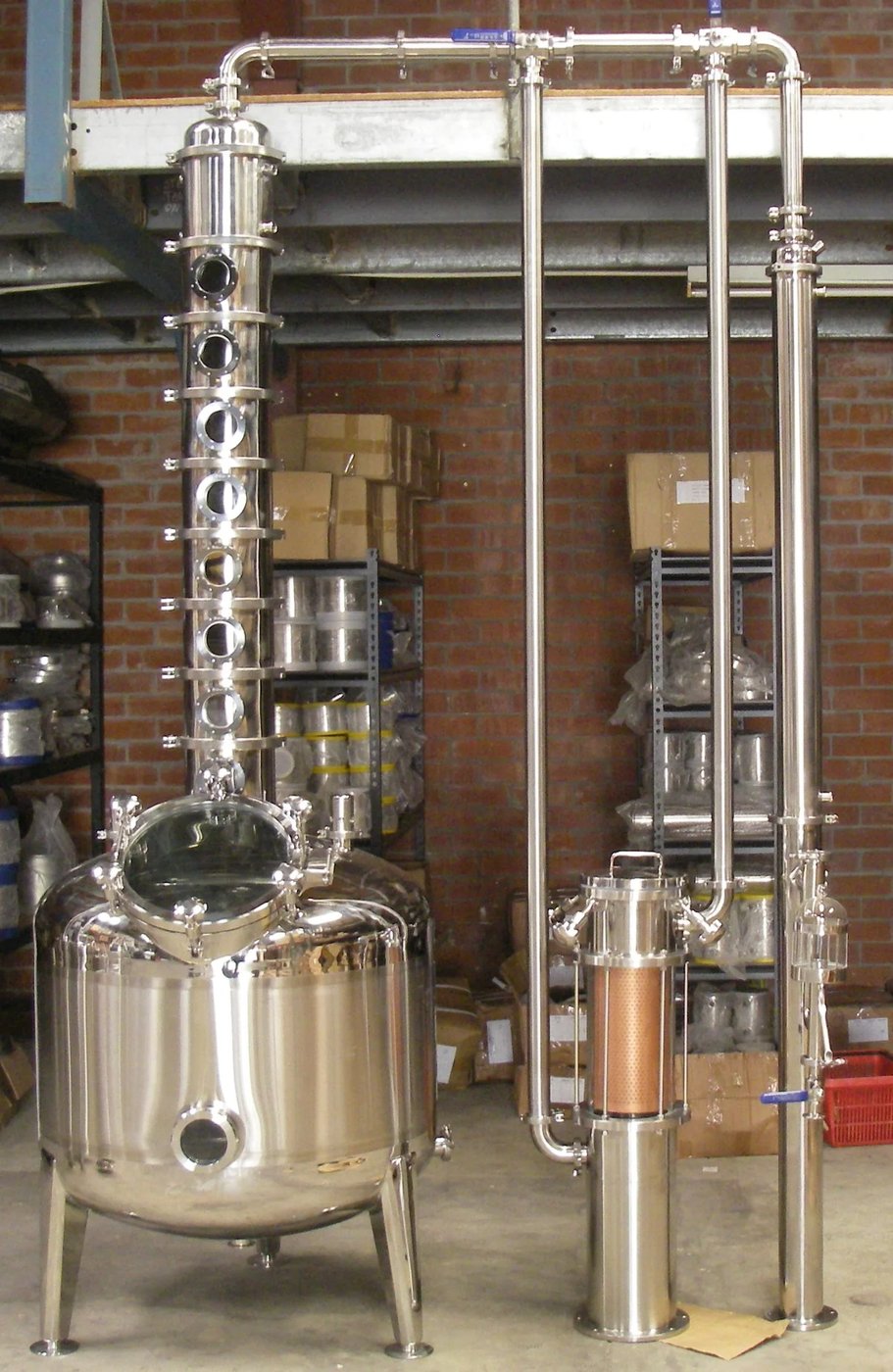 A StillDragon 8-gallon tri-clamp modular Tier-4 build with multiple top configurations available — pot-still head, bubble-cap plate column, dephlegmator, gin basket — illustrating the multi-mode flexibility that defines the Tier-4 hybrid philosophy